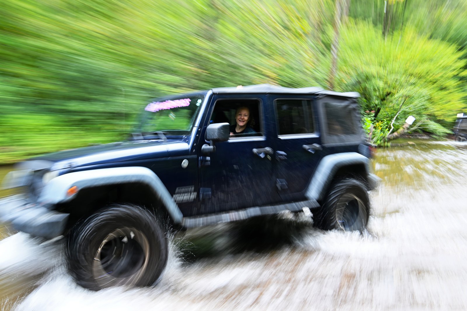 Jeep blasting through the water