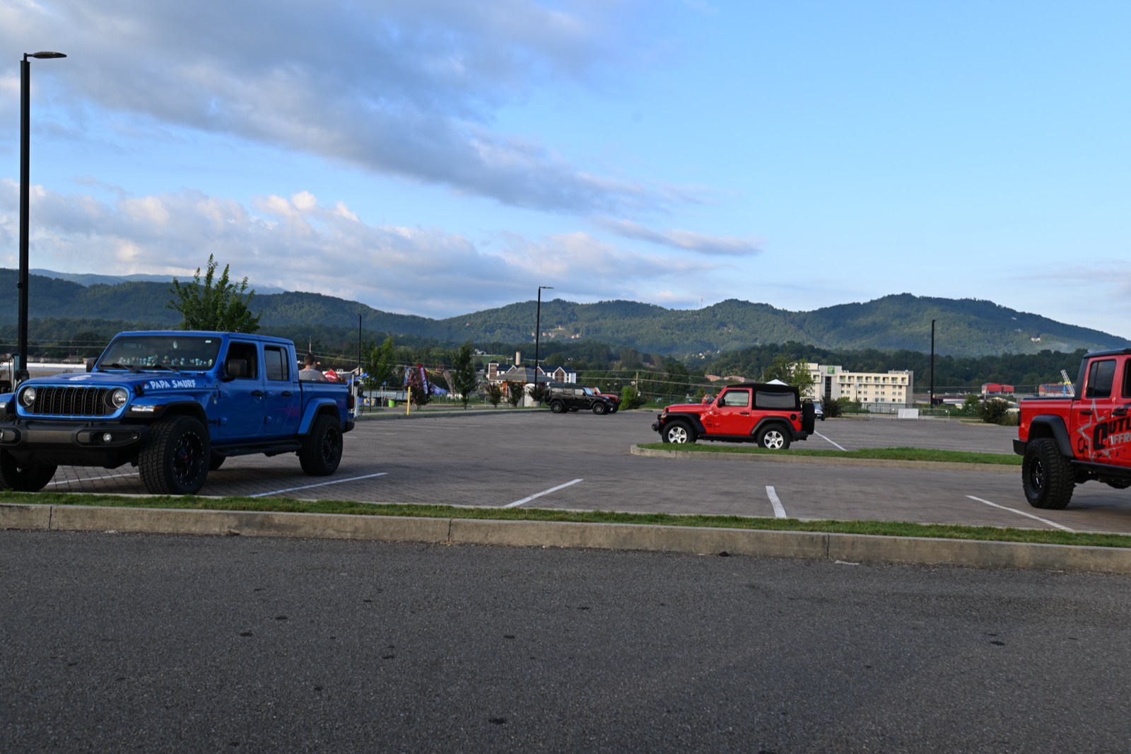Jeeps staged in Pigeon Forge with the Smokies behind them