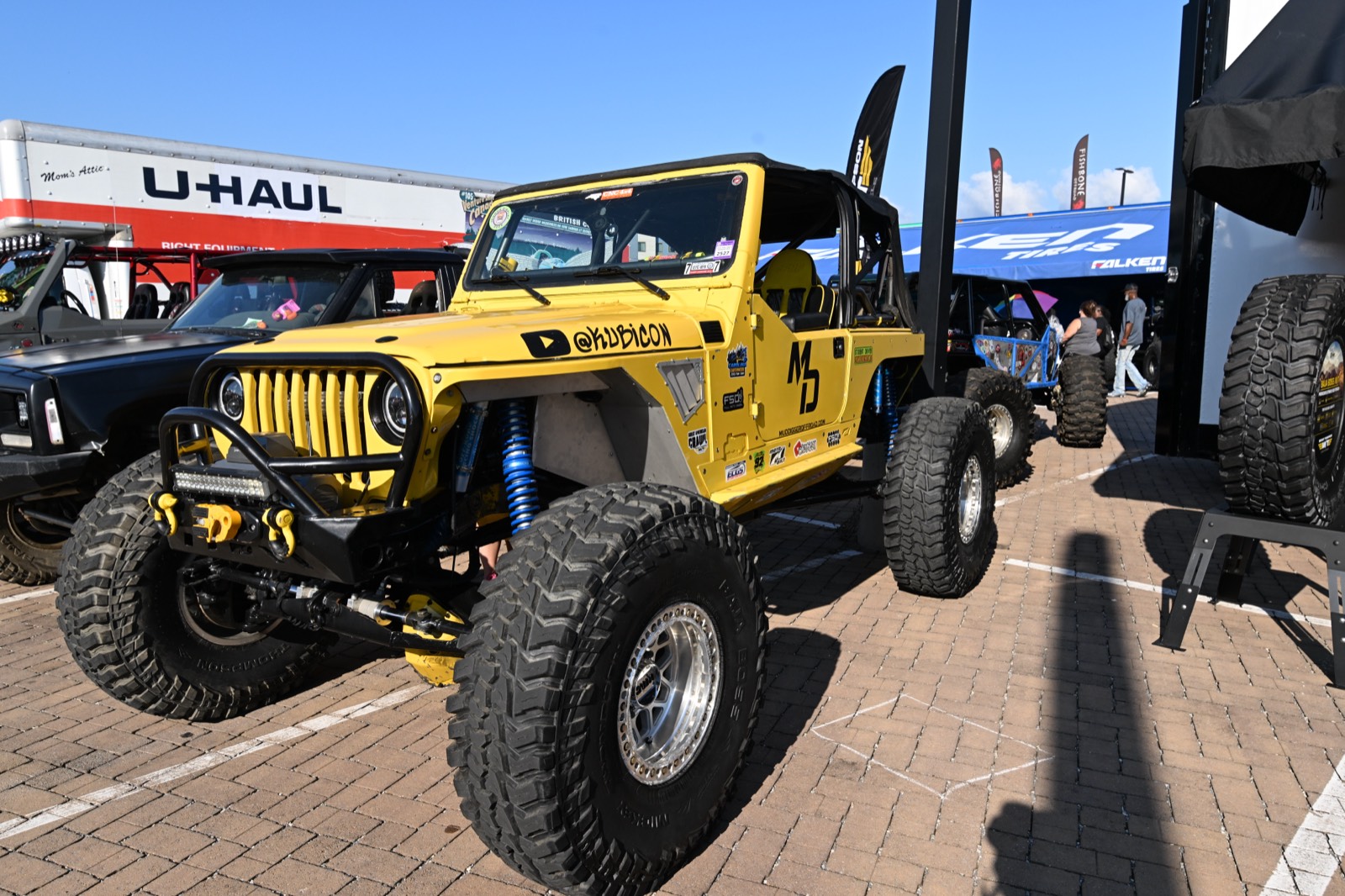 Custom yellow Jeep on the outdoor lot